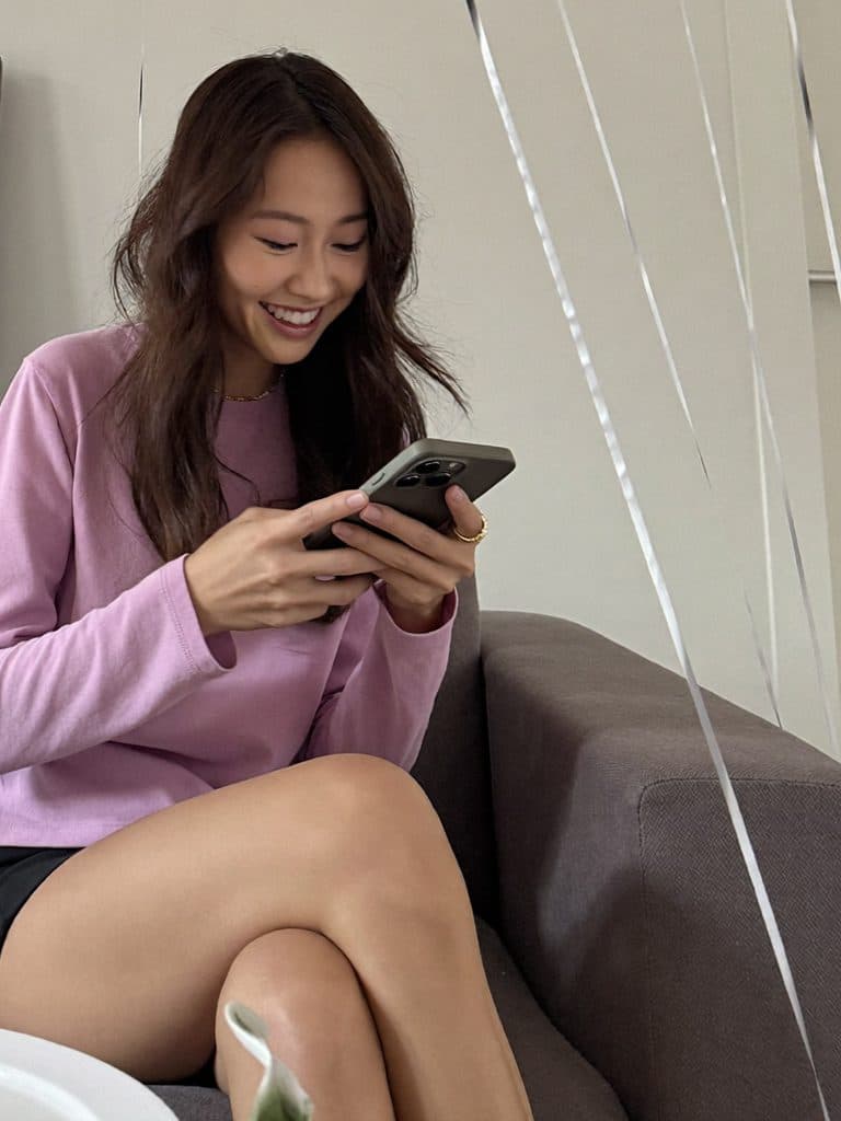 Woman planning a party on her phone
